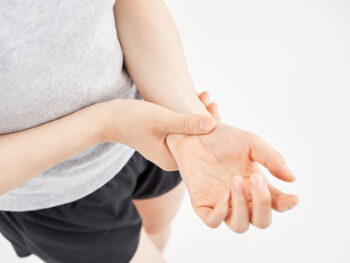 a person holding her wrist