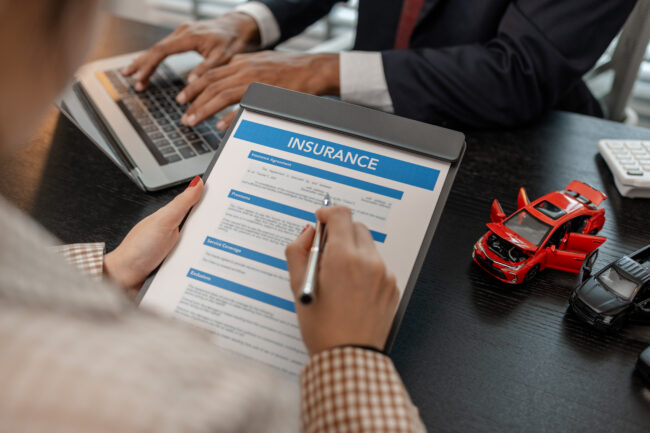 a lawyer explains the details of a car insurance policy and all the costs to a client, a lawyer explains to a client what will happen if she dose not have car insurance