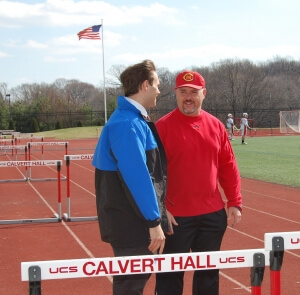 Dr. Detterline speaks to track coach at Calvert Hall