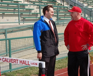 Dr. Detterline speaking with coach