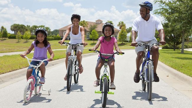 Parents and children riding bicycles