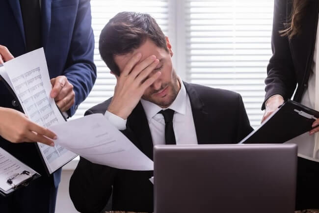 Man showing stress at desk