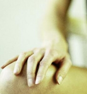 hand resting on knee