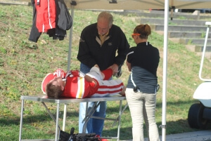 Dr. C treats injured football player on sideline